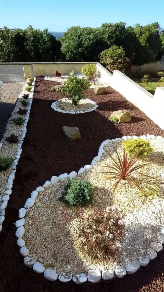 Elegant Low-Maintenance Garden With Mulch & Pebble Landscaping